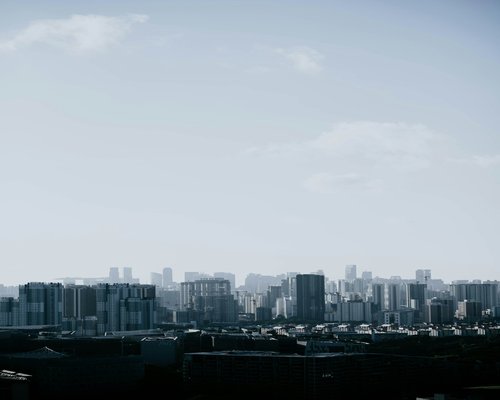 Distant view of a high altitude city skyline with clear skies